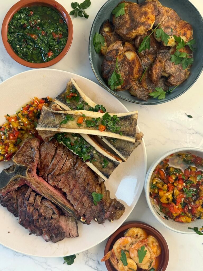 Florentine-Style T-Bone Steak dinner with Bone Marrow and Two Chimichurris